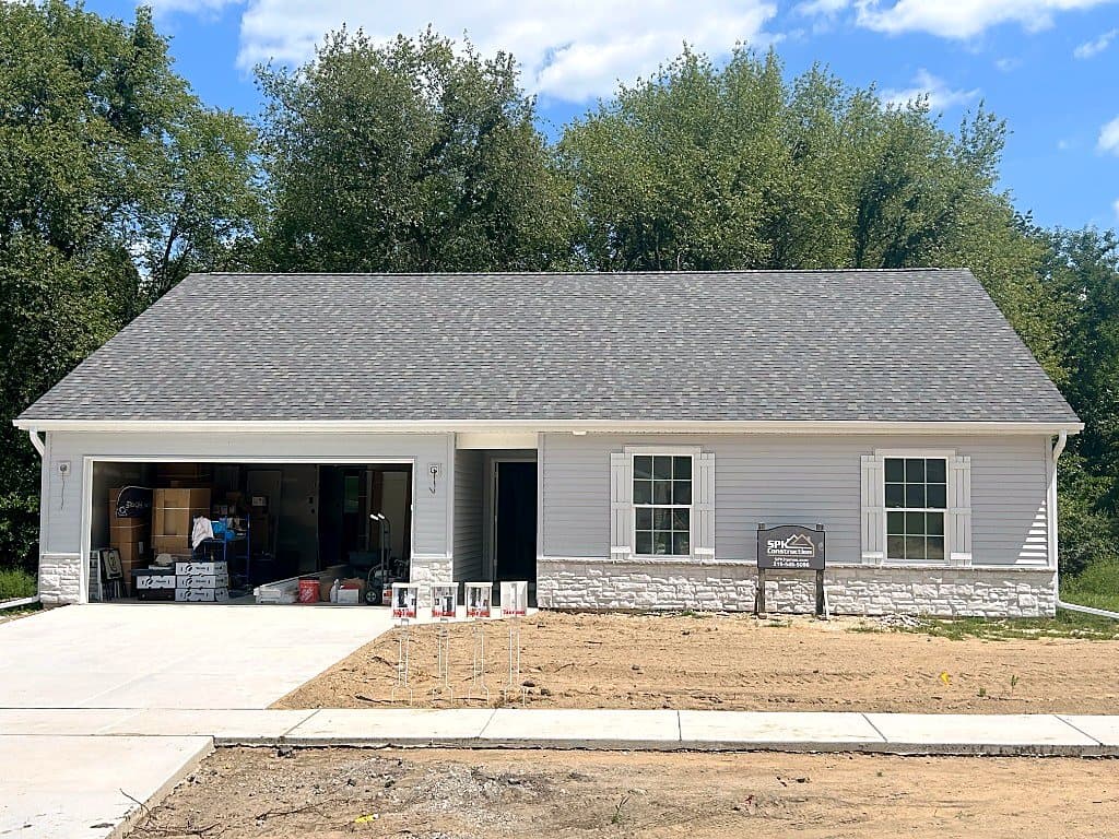 The Addy, a gray single-story ranch with a stone wainscot on Fernway Road